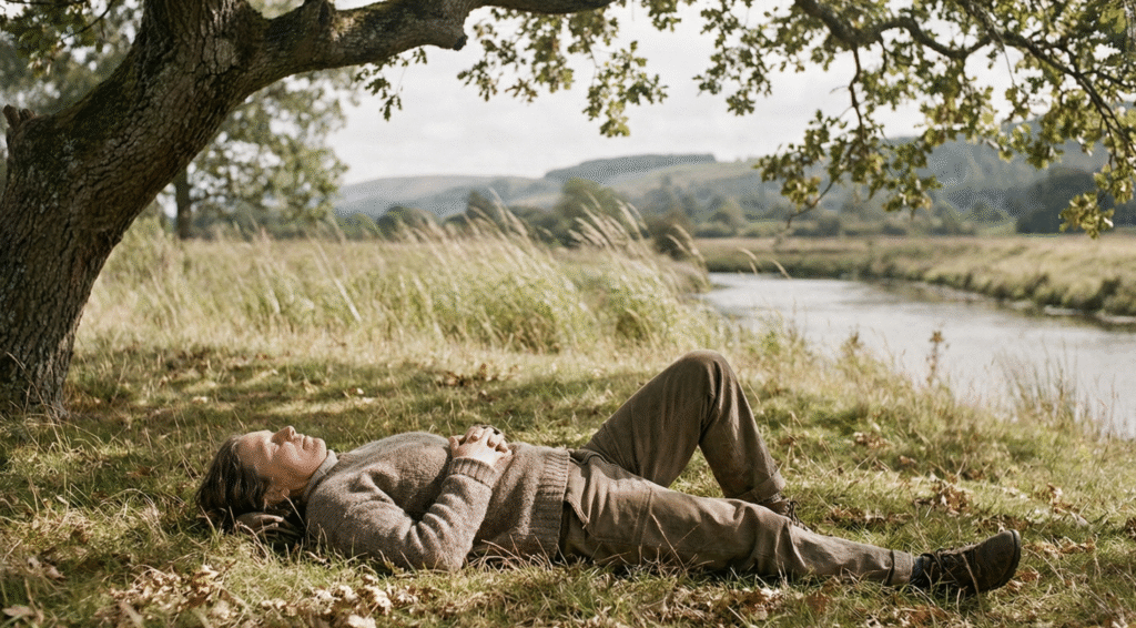 A person resting peacefully on the earth in soft natural light, symbolizing integration and mindful living in harmony with nature.
